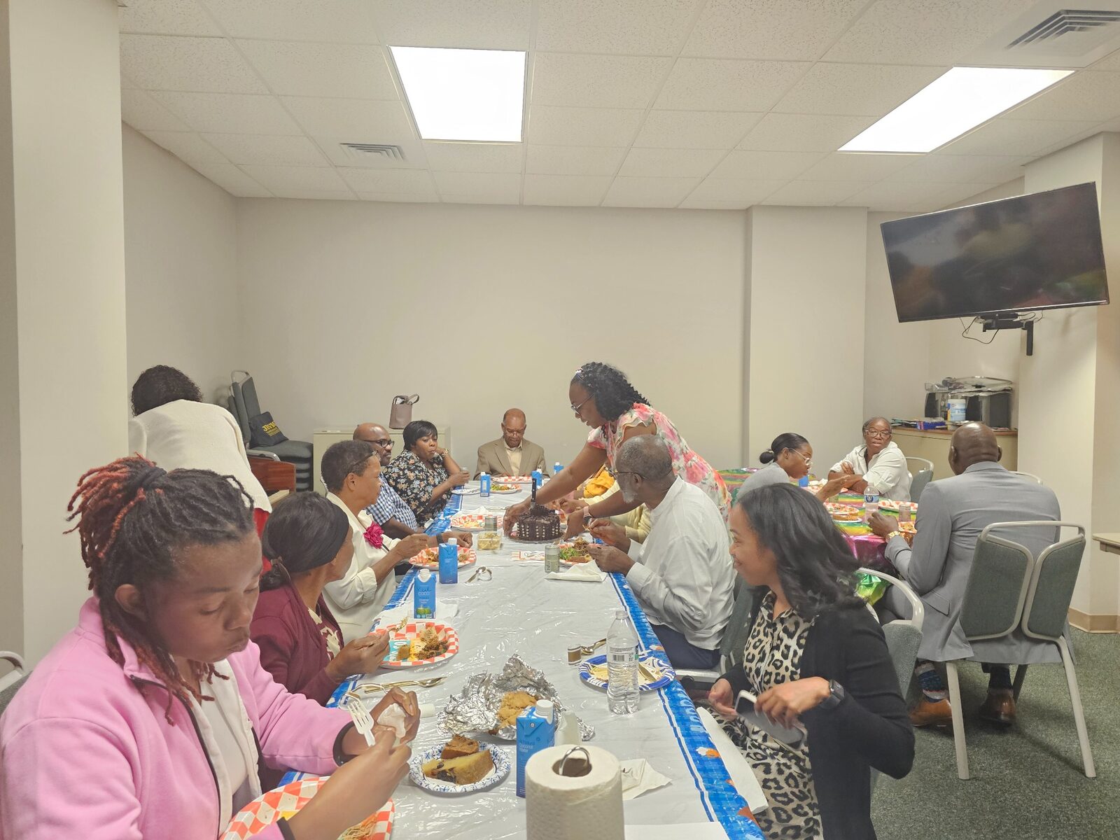 Members of Hearts of Love Ministry gathered around the fellowship table