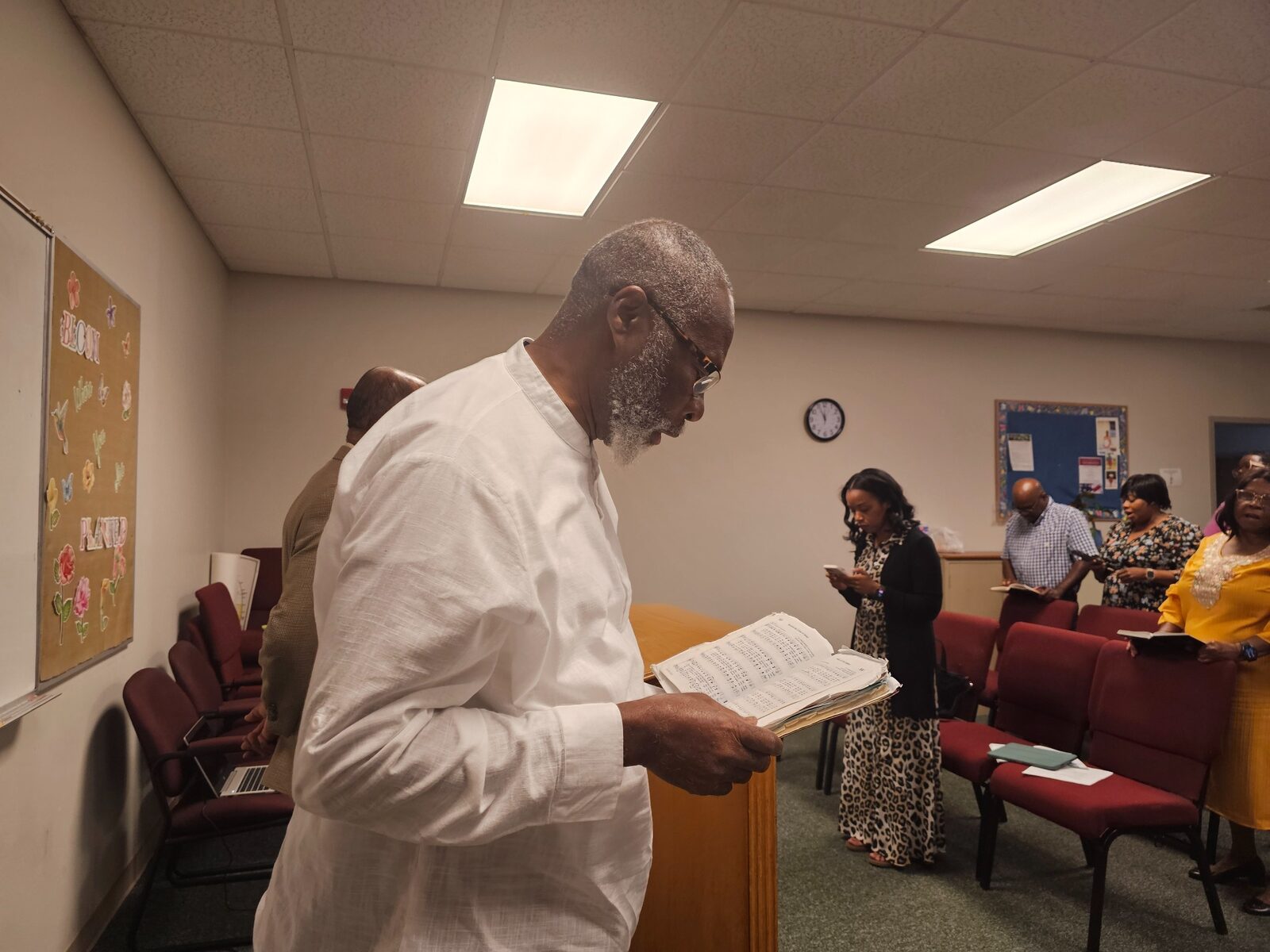 A church member reading during worship