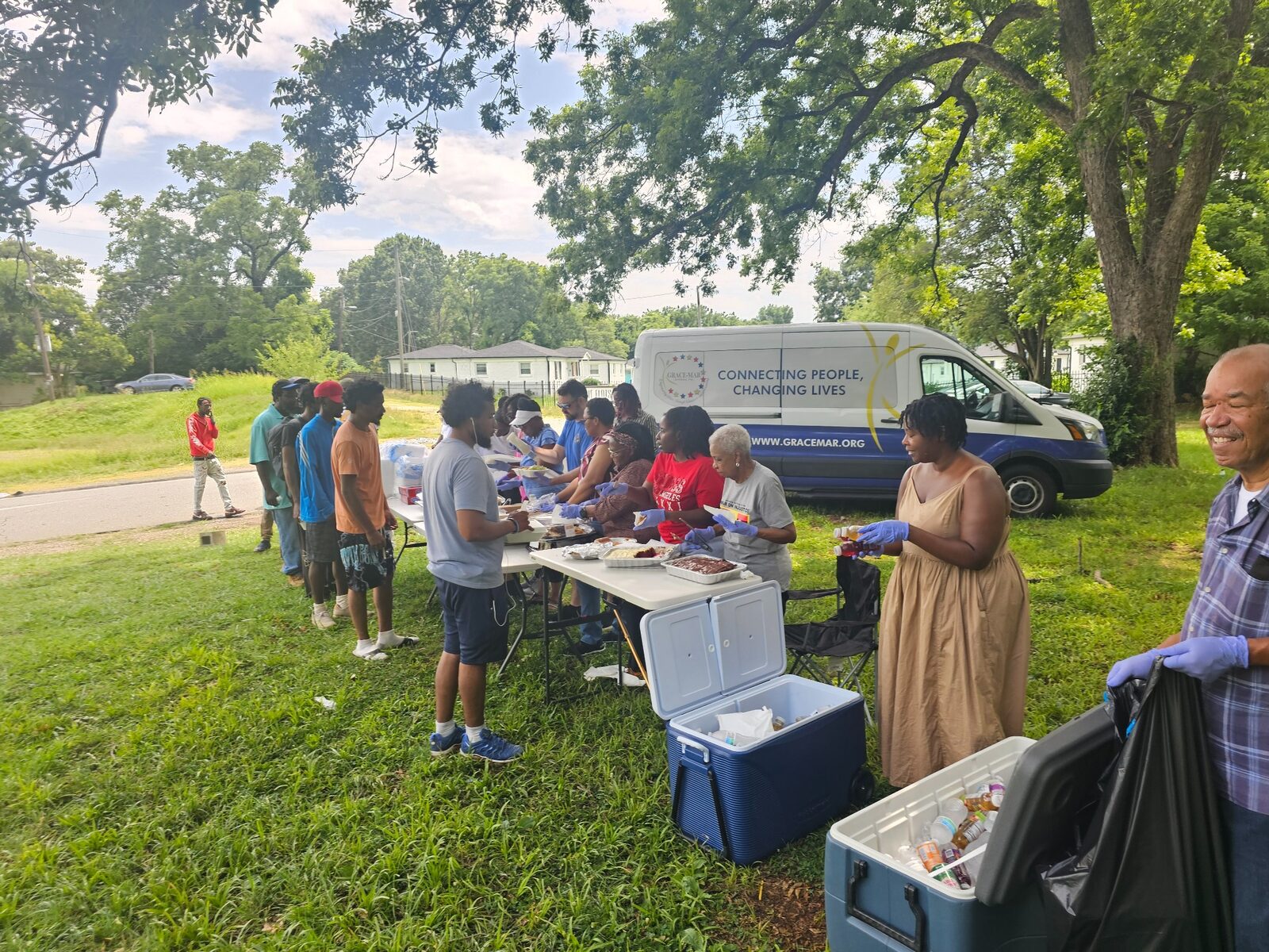 Volunteers distributing food outdoors